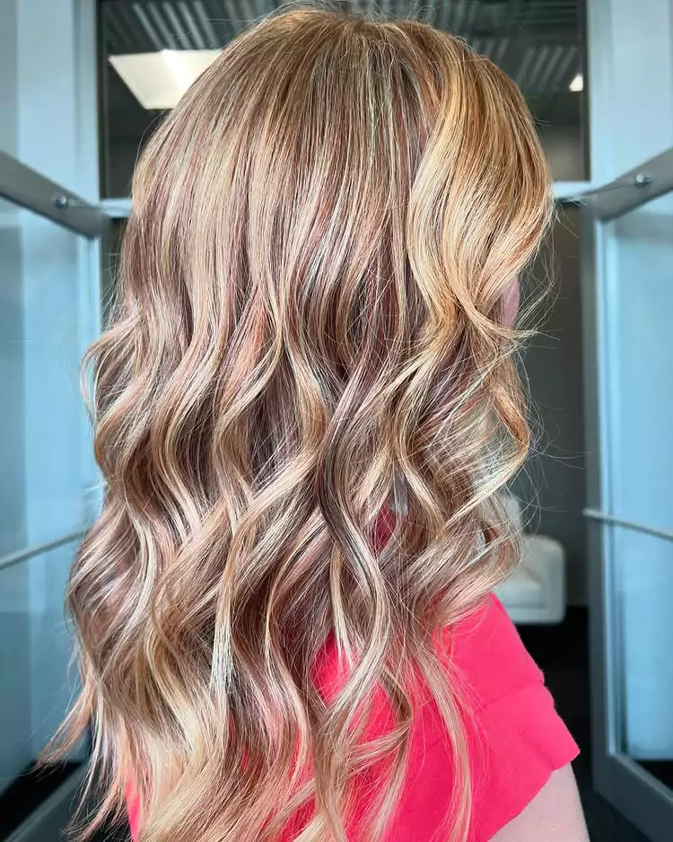 Cascading Strawberry Blonde Waves