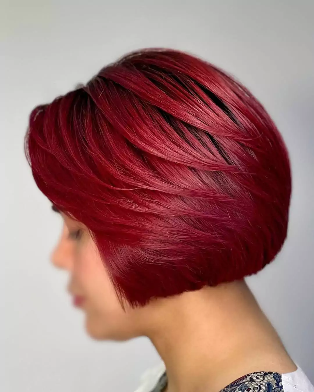 Cherry Red Layered Bob with Face-Framing Movement