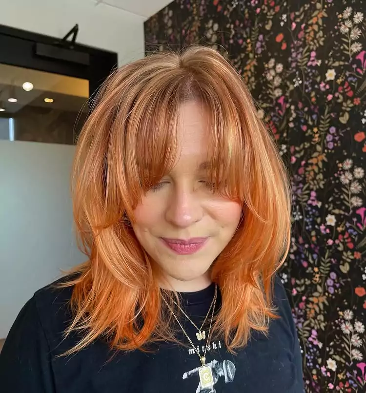 Layered Strawberry Blonde Shag with Face-Framing Bangs