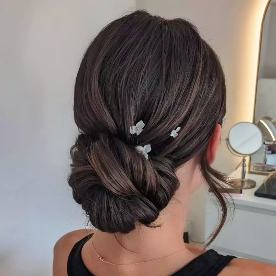 Twisted Low Chignon with Floral Accents